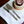 Záhra Chandi Cake Server Set of 2, featuring elegant silver blades with detailed brass handles, displayed beside a decorated cake.